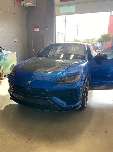 Lamborghini Urus in the JRD Round Rock shop for auto glass service