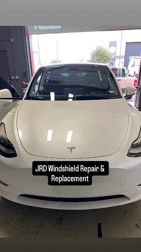 Tesla Model Y in the JRD shop for windshield replacement and Autopilot camera calibration